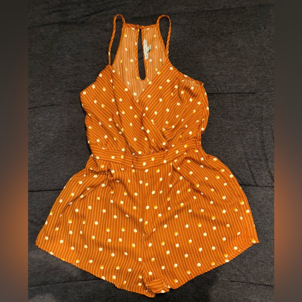 A brown romper size medium from Haute Momde